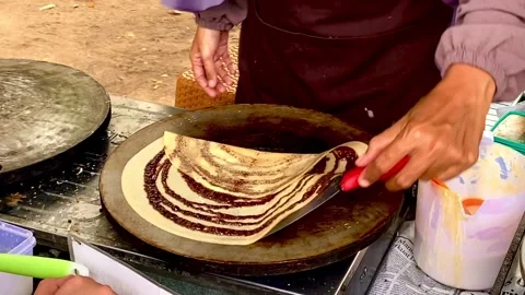The process of making lekker cake or outdoor lekker cake. Traditional snacks Stock Footage 288611713