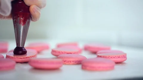 Process of making macaron macaroon, french dessert, squeezing the dough form Vídeos de archivo 128549652