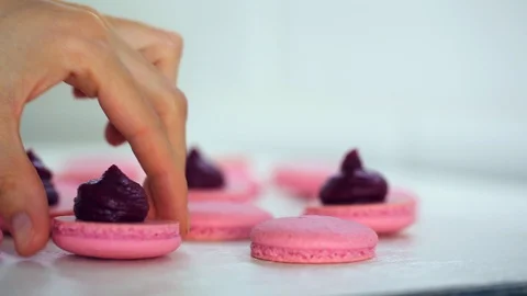 Process of making macaron macaroon, french dessert, squeezing the dough form Stock-Footage 128549689