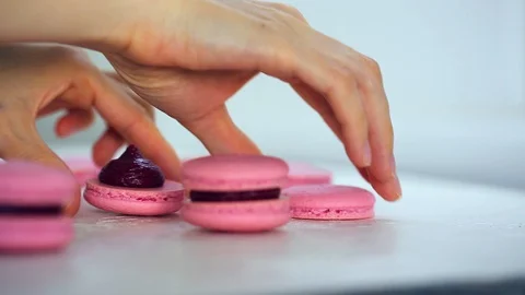 Process of making macaron macaroon, french dessert, squeezing the dough form Vídeos de archivo 128707461