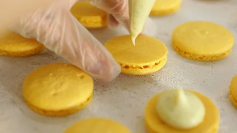Process of making macaron macaroon, french dessert, squeezing the dough form Vídeos de archivo 129783993
