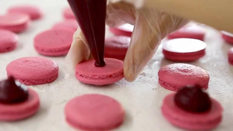Process of making macaron macaroon, french dessert, squeezing the dough form Stock Footage 129785526