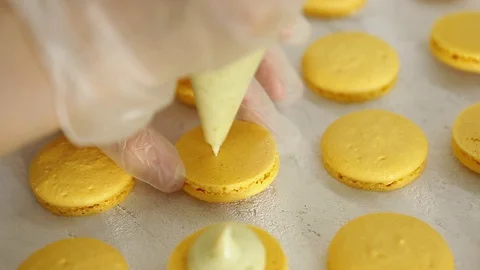 Process of making macaron macaroon, french dessert, squeezing the dough form Vídeos de archivo 129852383