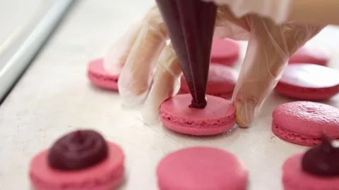 Process of making macaron macaroon, french dessert, squeezing the dough form Video stock 129917559
