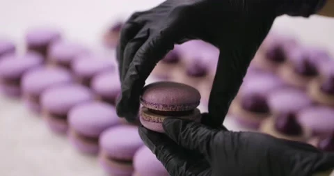 Process of making macaron macaroon, french dessert. Assembly of two halves with Stock-Footage 148689189