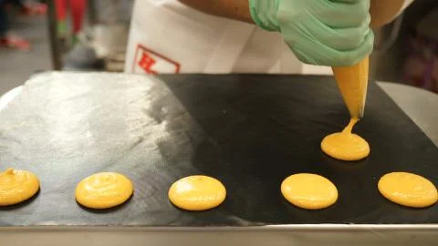 Process of making macaron macaroon, french dessert, squeezing the dough form Fotos Stock