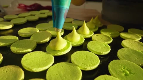 Process Of Making macaroon at home. Shot of hands of female pastry chef holding Video stock 153687986