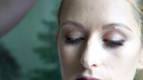 Process of making makeup. Make-up artist applied with brush on model face. Stock Footage 138076689