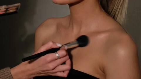 Process of making makeup. Make-up artist working with brush on model woman. Vídeos de archivo 144346960