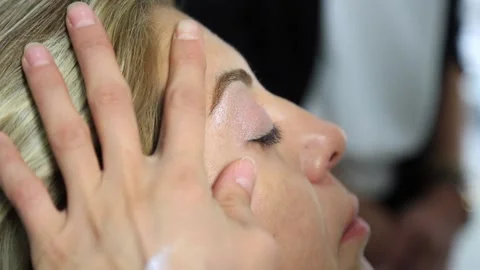 Process of making makeup. Make-up artist working with brush on model face. Stock Footage 164712150