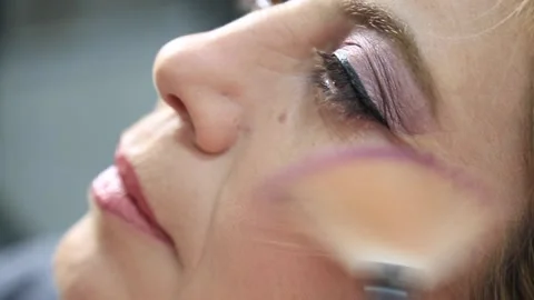 Process of making makeup. Make-up artist working with brush on model face. Stock Footage 164712159