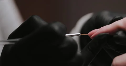 Process of making manicure, macro. Closeup of applying base coat on client  Video stock 149366997