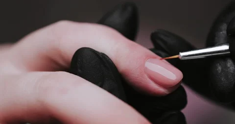 Process of making manicure, macro. Closeup of applying base coat on client  Video stock 149367009