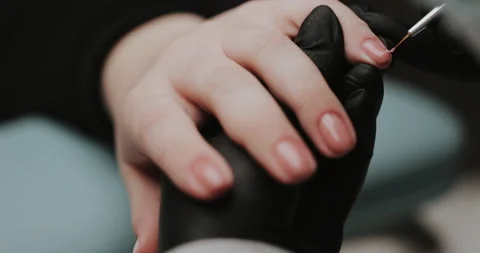 Process of making manicure, macro. Closeup of applying base coat on client  Video stock 149367110