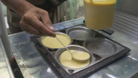 The process of making Martabak mini (Terang Bulan), a typical Indonesian street Stock Footage 301151286
