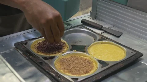 The process of making Martabak mini (Terang Bulan), a typical Indonesian street Stock Footage 301151333