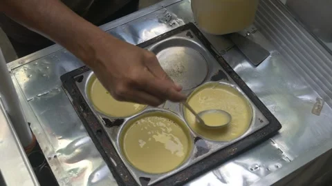 The process of making Martabak mini (Terang Bulan), a typical Indonesian street Stock Footage 301151385