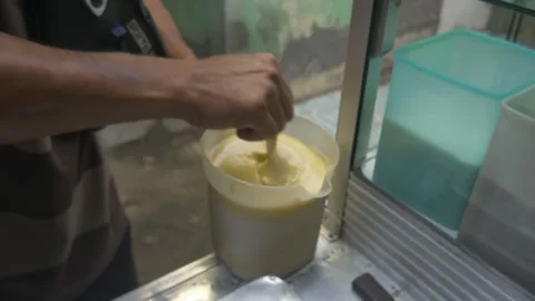 The process of making Martabak mini (Terang Bulan), a typical Indonesian street Stock Footage 301151392