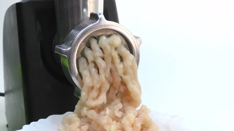 The process of making minced meat from chicken using an electric meat grinder. Stock Footage 119489683