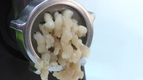 The process of making minced meat from chicken using an electric meat grinder. Stock Footage 119489935