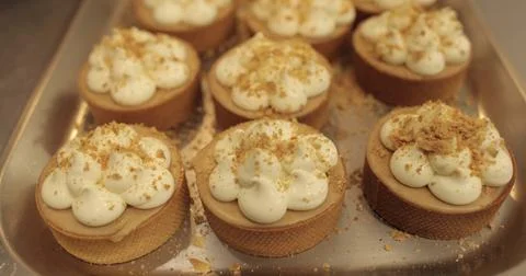 The process of making mini tarts. Sprinkle and decorate mini tarts with gra.. Stock Photos