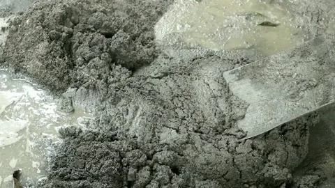 The process of making a mixture of cement and sand manually Stock Footage 221417127
