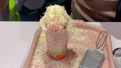 The process of making modern green banana ice (es pisang ijo) . Stock Footage 320501571