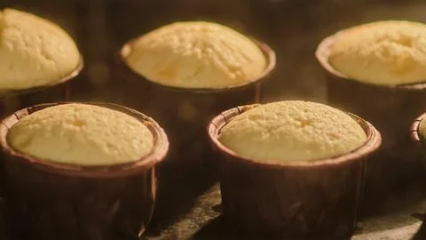 The process of making muffins in the oven, timelapse. Cupcake dough rises at the Stock Photos