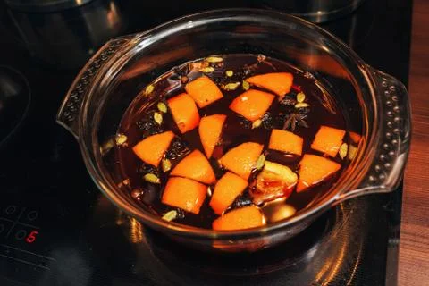 The process of making mulled wine at home in the kitchen. example of how a ho Stock Photos