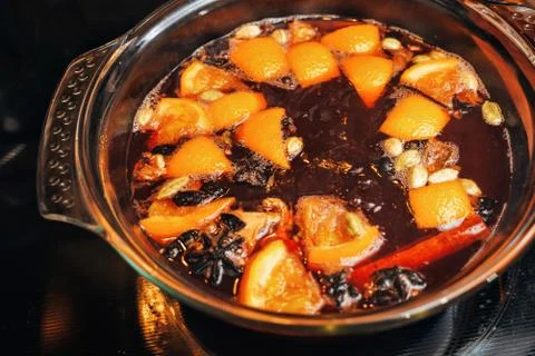 The process of making mulled wine at home in the kitchen. example of how a ho Stock Photos