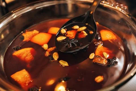 The process of making mulled wine at home in the kitchen. example of how a ho Stock Photos