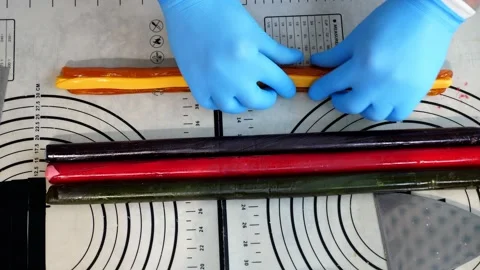 The process of making multi-colored lollipops in a confectionery kitchen. Stock Footage 330522776