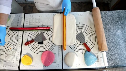 The process of making multi-colored lollipops in a confectionery kitchen. Stock Footage 331696811