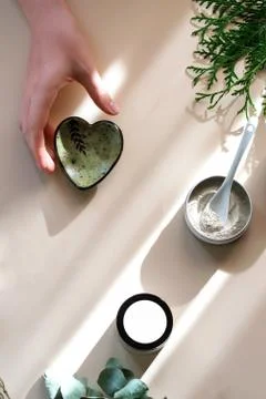 Process of making natural cosmetics from green clay. Stock Photos