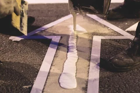 Process of making new road surface markings with line striping machine, wor.. Stock Photos