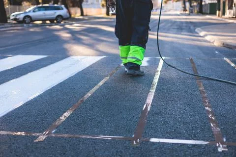 Process of making new road surface markings with a line striping machine, w.. Stock Photos