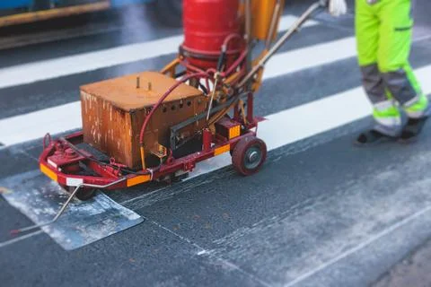 Process of making new road surface markings with a line striping machine, w.. Stock Photos