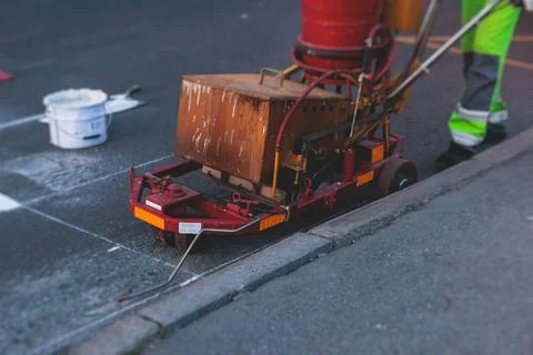 Process of making new road surface markings with a line striping machine, w.. Stock Photos