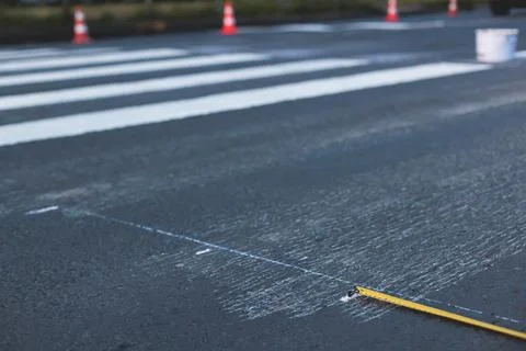 Process of making new road surface markings with a line striping machine, w.. Stock Photos