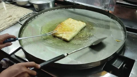 The process of making or cooking an Martabak Telur Stock-Footage 218168601