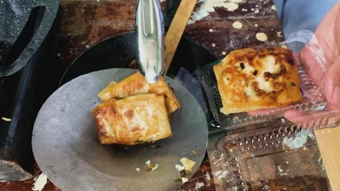 Process of making or cooking martabak eggs, Indonesian street food. Видео 297964797