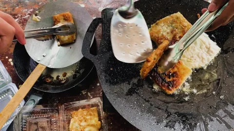 Process of making or cooking martabak eggs, Indonesian street food. Stock Footage 297964804