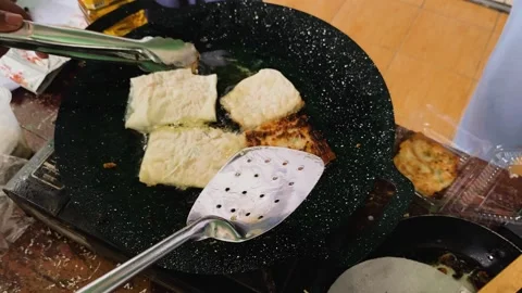 Process of making or cooking martabak eggs, Indonesian street food. Stock Footage 297965255
