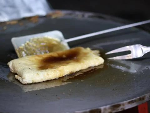 The process of making or cooking an Martabak Telur Foto stock