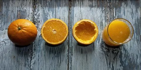 Process of making an orange juice, three oranges and a glass of freshly squ.. Stock Photos