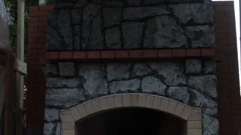 Process of making an outdoor garden fireplace Stock Footage 285262392