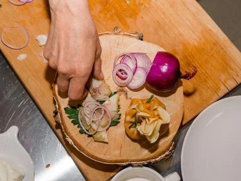 The process of making pancakes. Cook in the kitchen makes the dough. Stock-Fotos