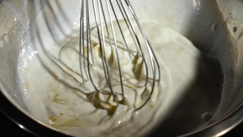 The process of making pancakes, the whisk whips the batter. Stock Footage 264402836