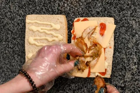 The process of making a panini in a fast food restaurant 스톡 사진