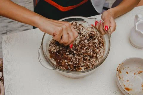 The process of making a pie. Cooking process with hands on a light background Stock Photos